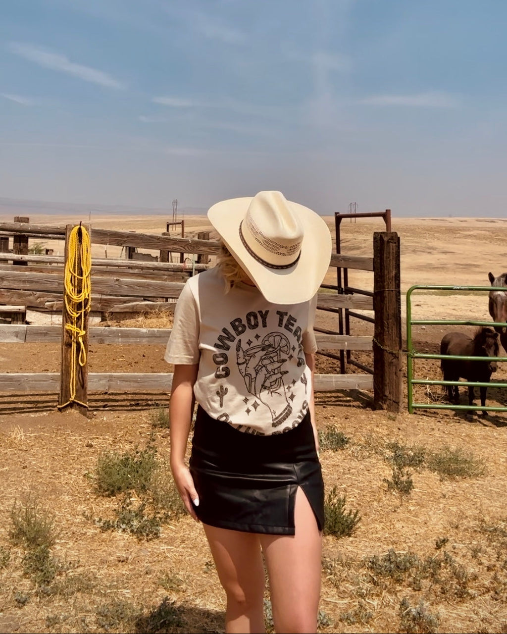 Tan western graphic tee with cowboy tears on the rocks whiskey glass country graphic shirt