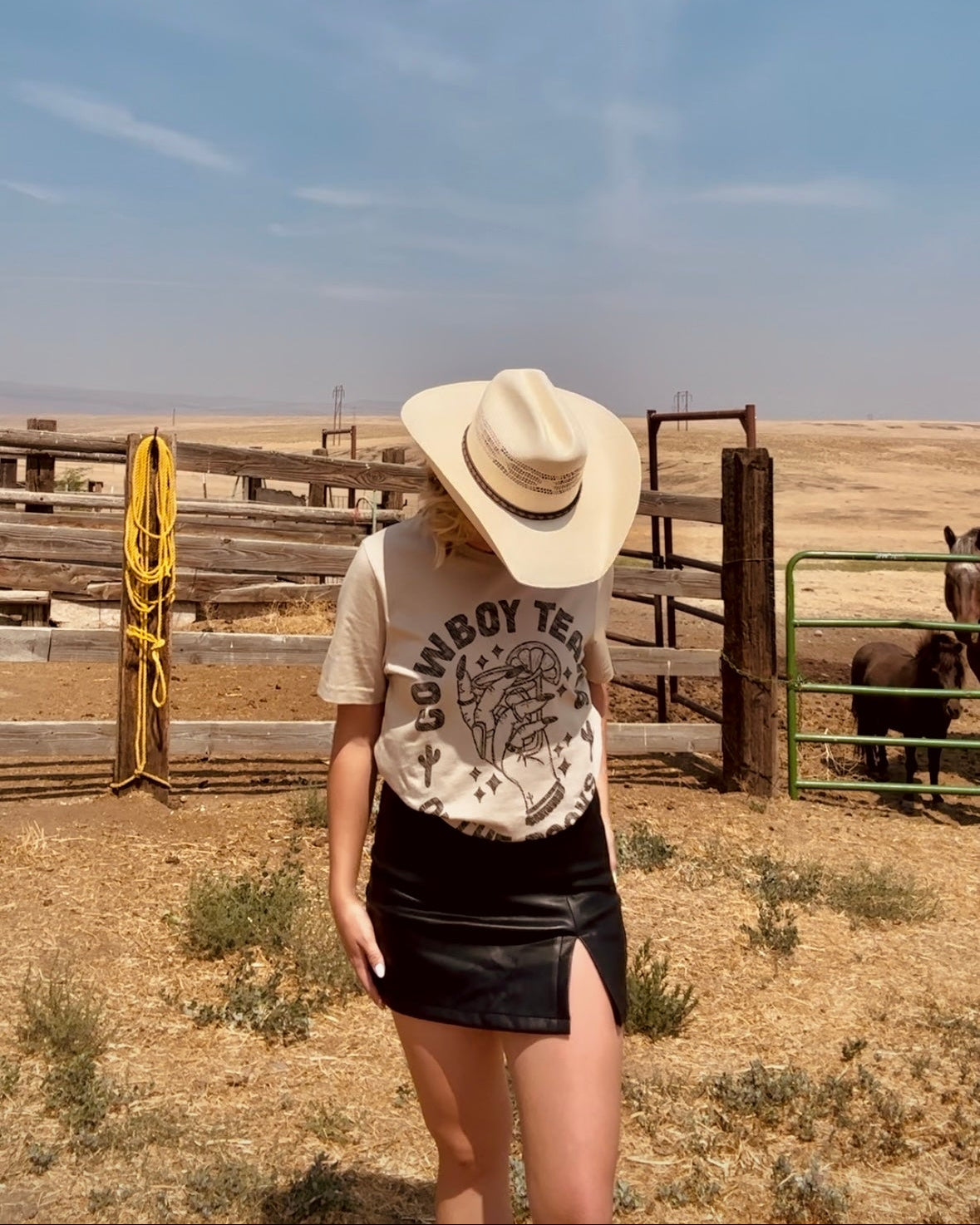 Tan western graphic tee with cowboy tears on the rocks whiskey glass country graphic shirt