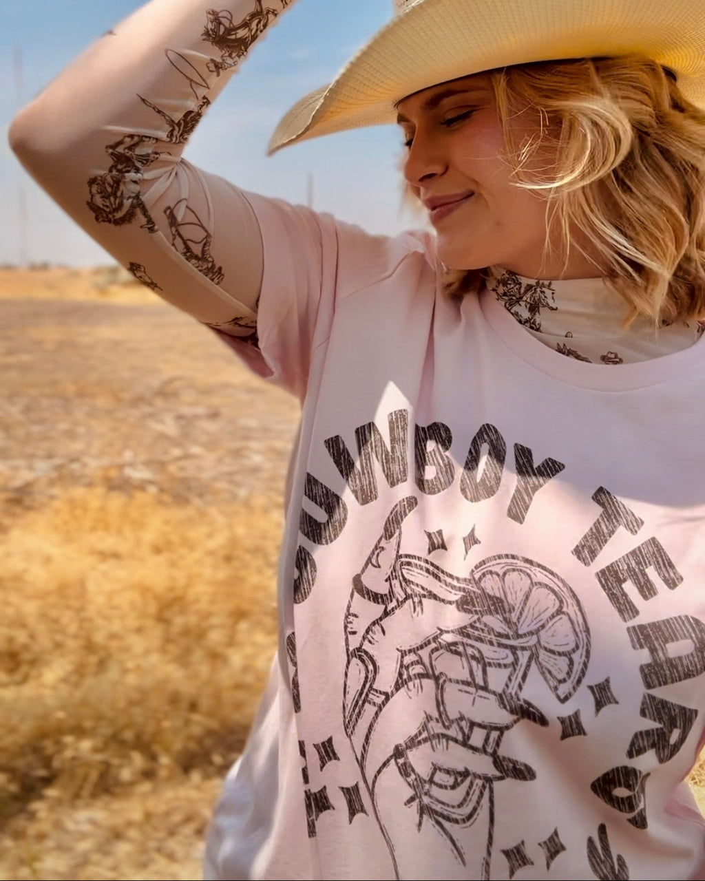 Pink cowboy tears on the rocks western graphic t-shirt for women