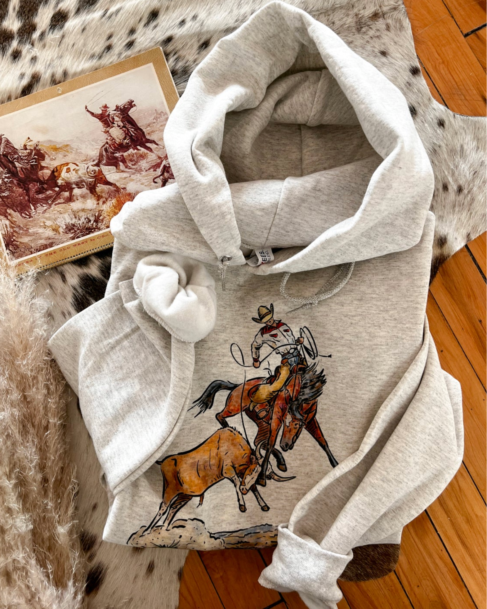 Grey unisex western hoodie with cowboy roping calf graphic rodeo style sweatshirt